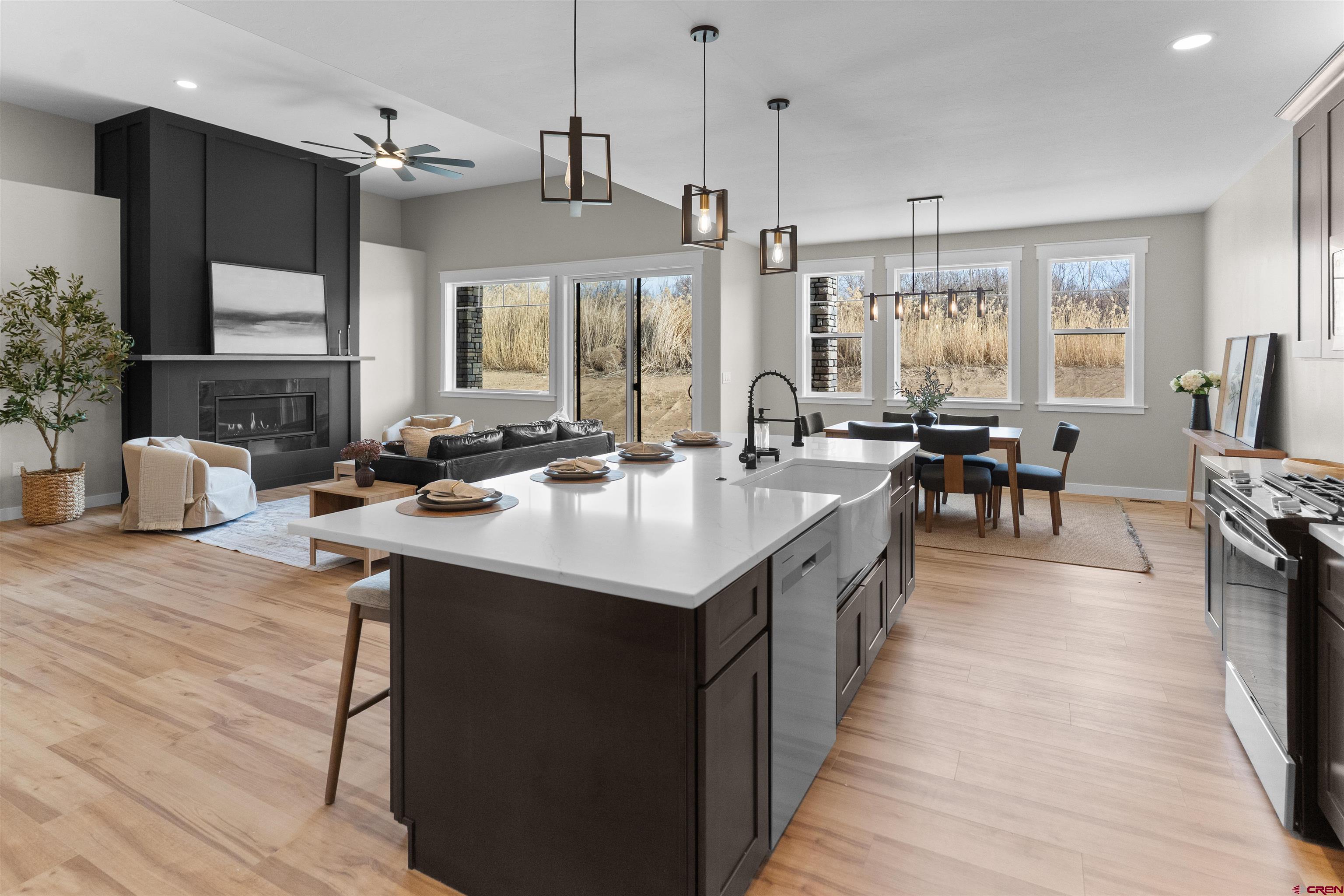 1539 Criterion Street Delta, CO 81416 - Photo 14 of 41 a kitchen with counter top space a sink appliances and living room view