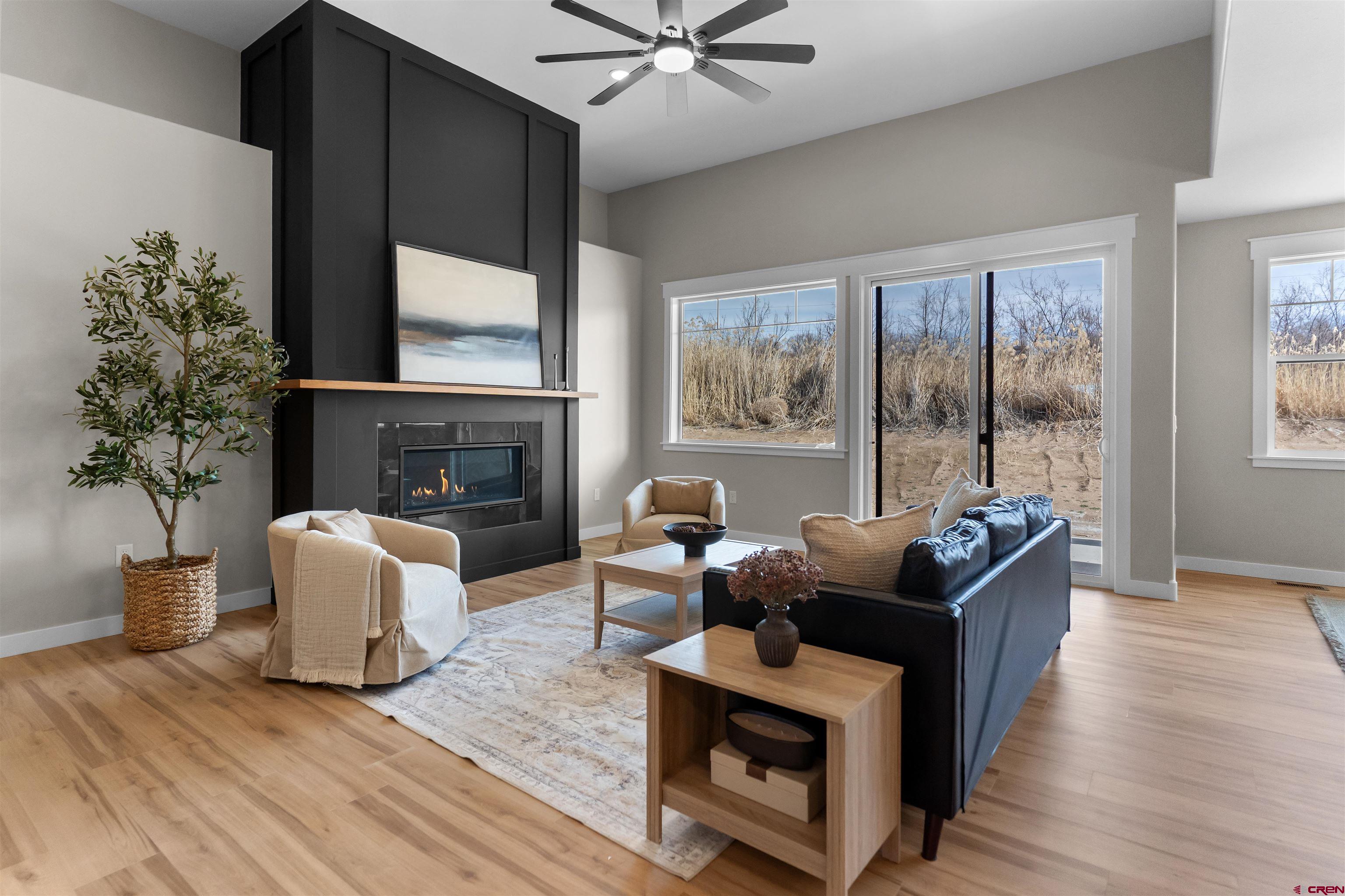 1539 Criterion Street Delta, CO 81416 - Photo 34 of 41 a living room with furniture and a fireplace
