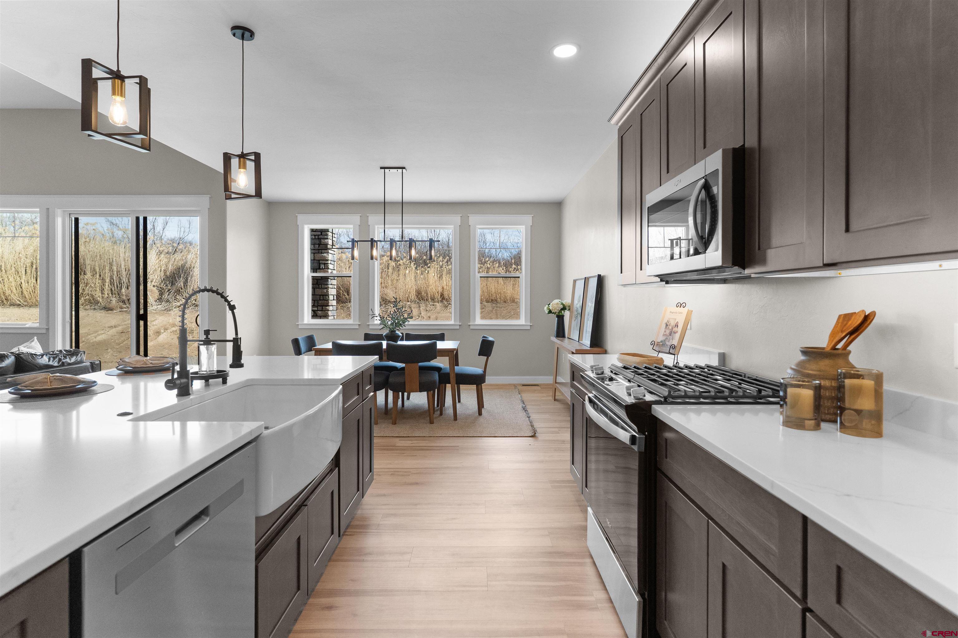 1539 Criterion Street Delta, CO 81416 - Photo 38 of 41 a kitchen with counter top space a sink appliances and cabinets