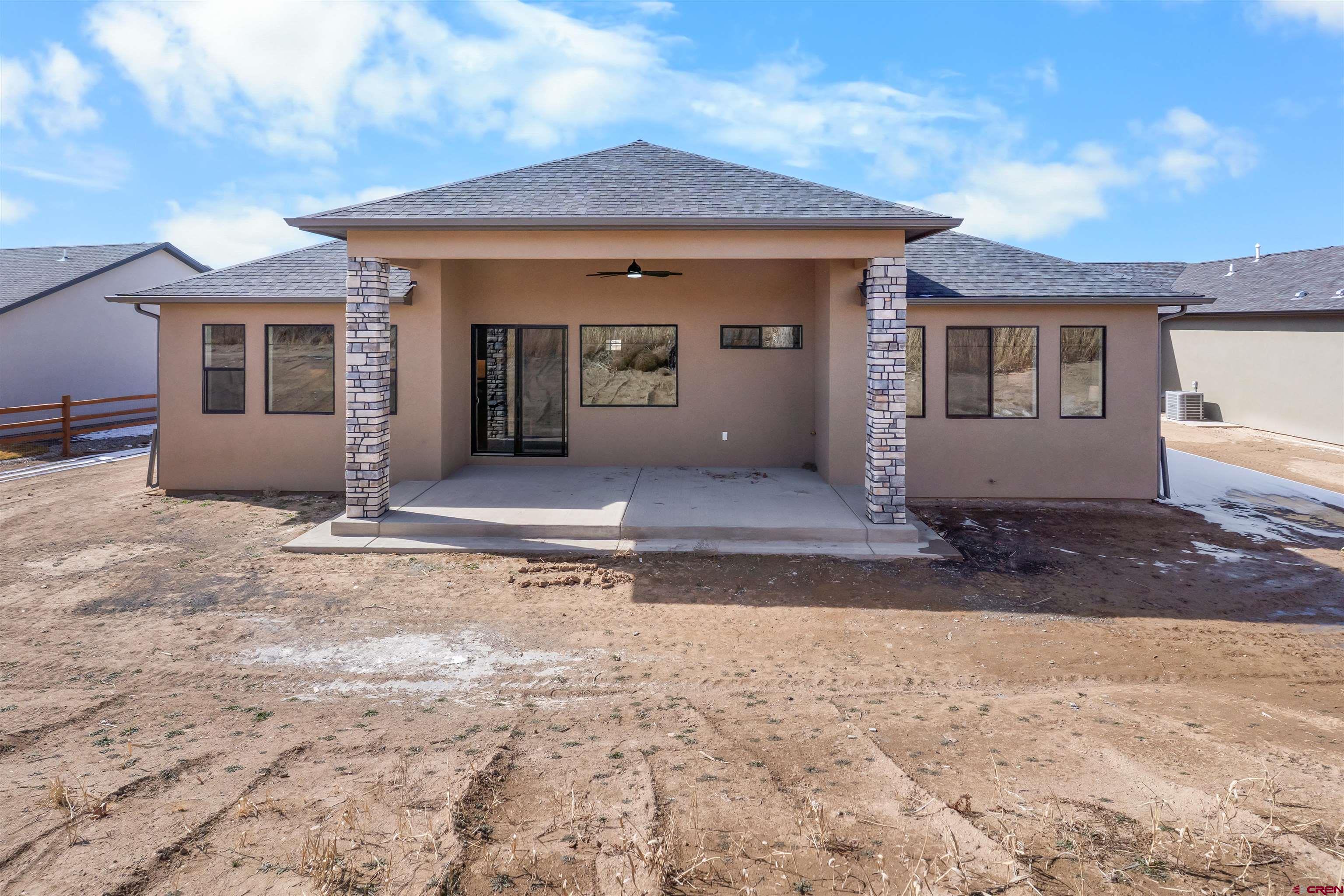 1539 Criterion Street Delta, CO 81416 - Photo 39 of 41 a front view of a house with a yard and garage