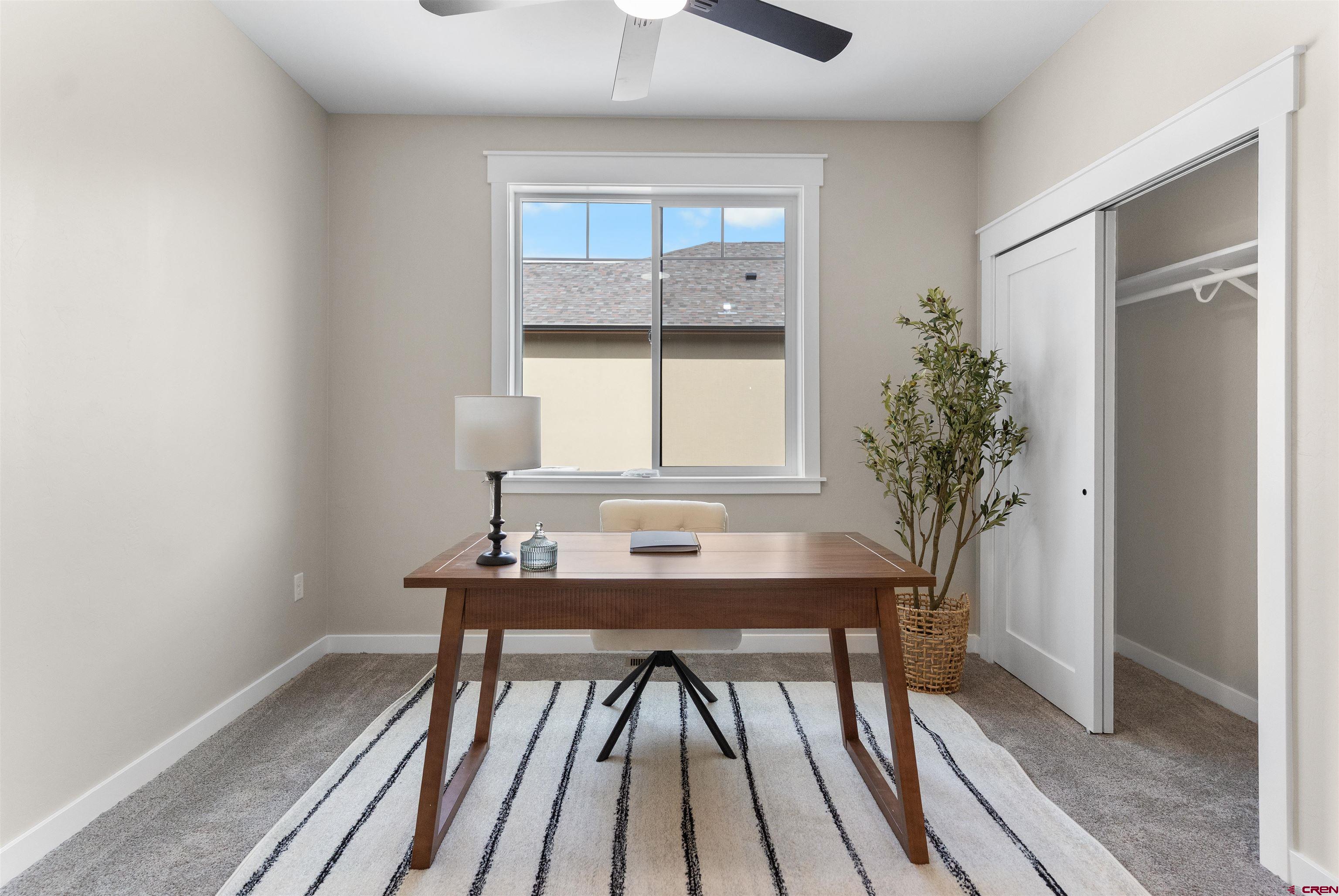1539 Criterion Street Delta, CO 81416 - Photo 5 of 41 a view of a workspace with furniture and window
