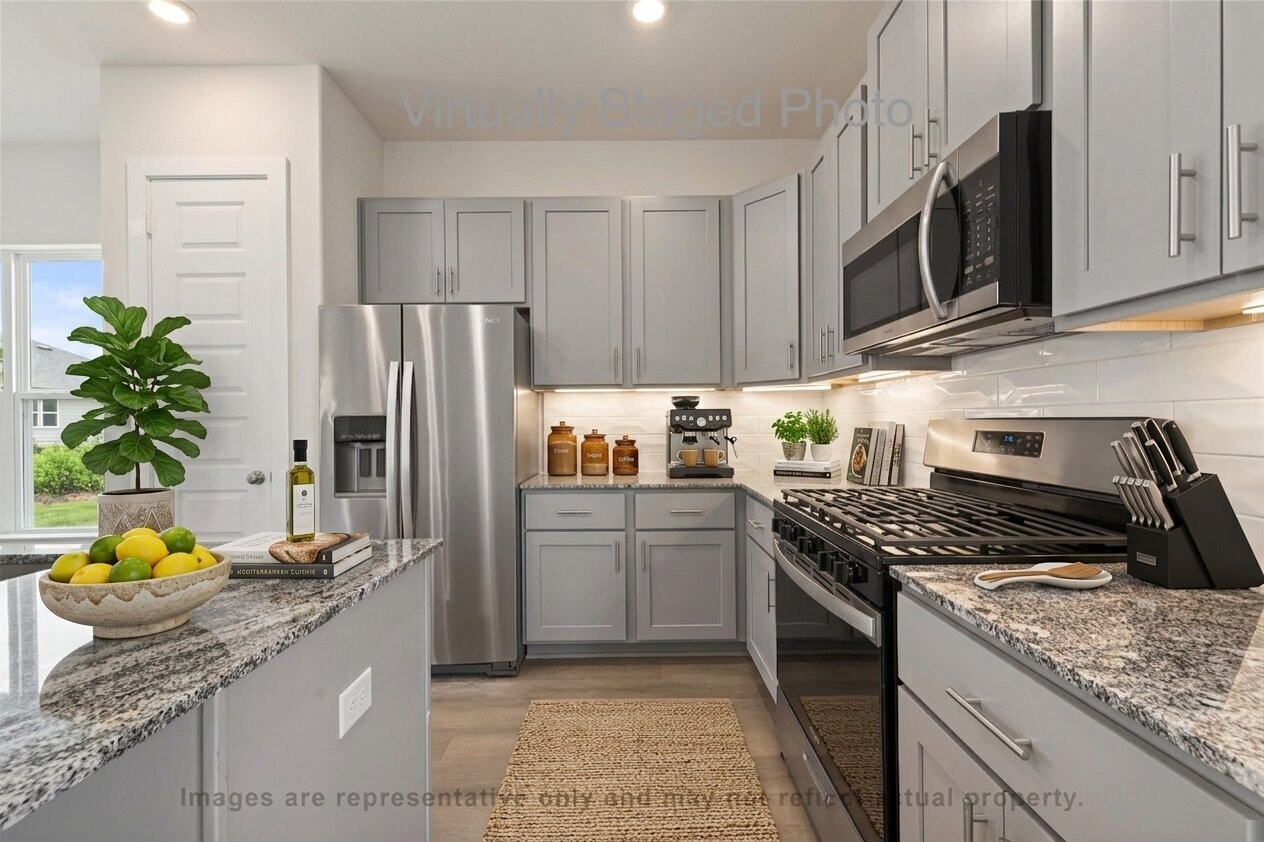 10719 Mason Road, Unit 15 Richmond, TX 77406 - Photo 9 of 50 Virtual Staging - Modern kitchen featuring gray cabinetry, granite countertops, stainless steel appliances, and a white subway tile backsplash