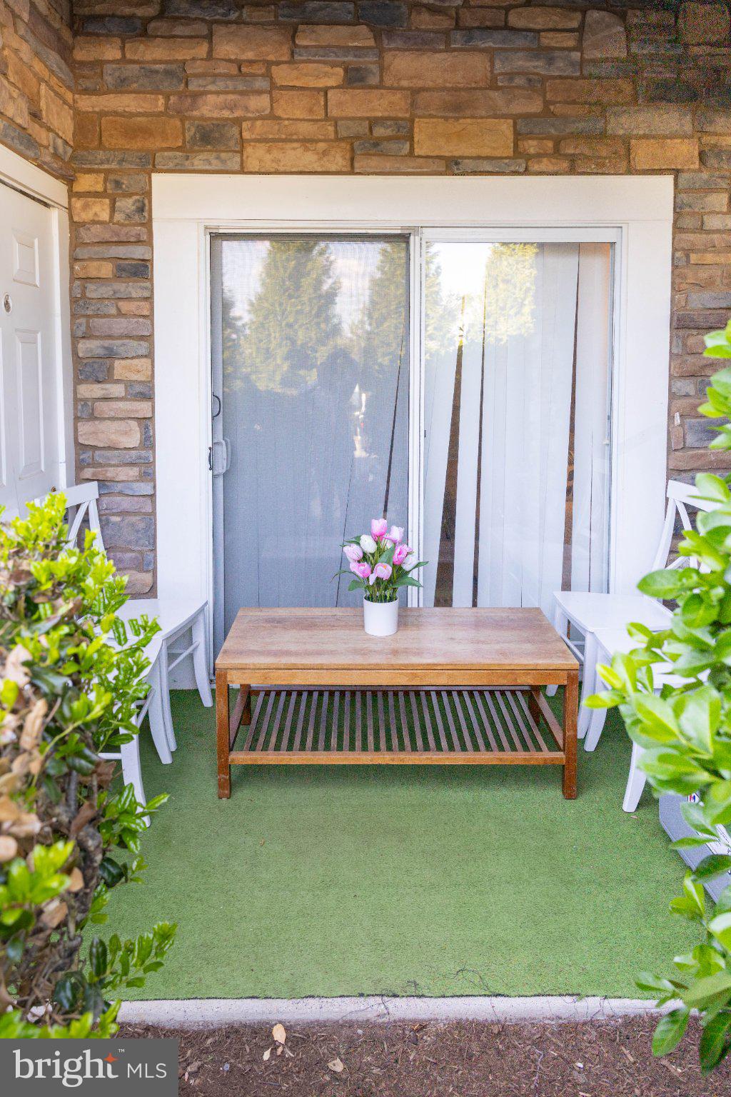 12824 Clarksburg Square Road, Unit 105 Clarksburg, MD 20871 - Photo 90 of 96 Charming patio retreat with greenery.