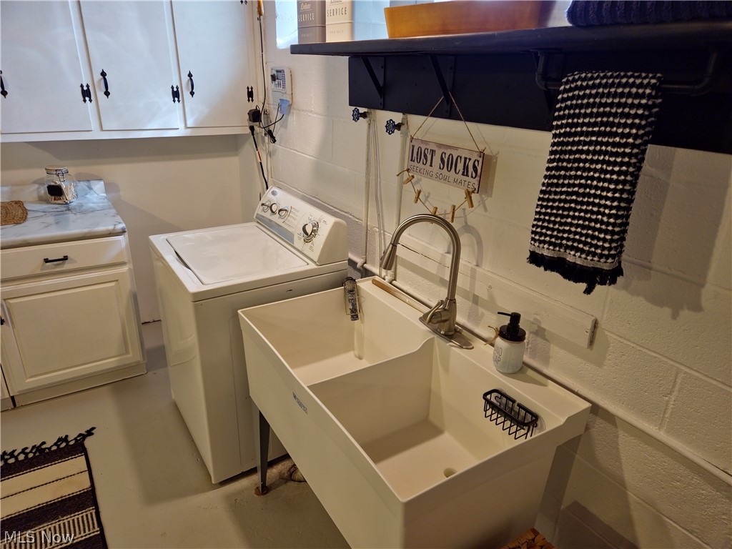 1681 Rush Road Wickliffe, OH 44092 - Photo 28 of 33 Laundry room with washer / clothes dryer, cabinets, and sink
