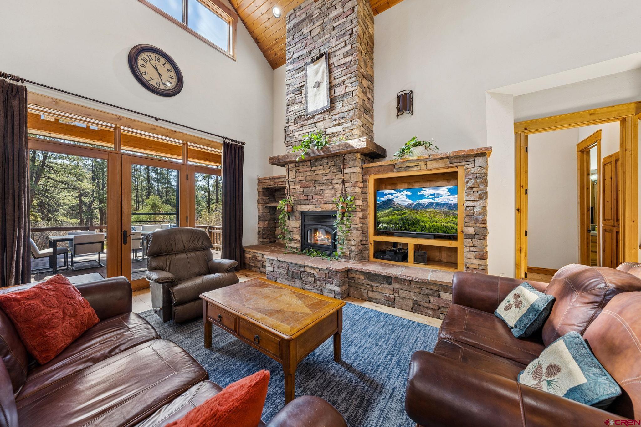 70 Clear Creek Loop Durango, CO 81301 - Photo 2 of 35 a living room with fireplace furniture and a large window