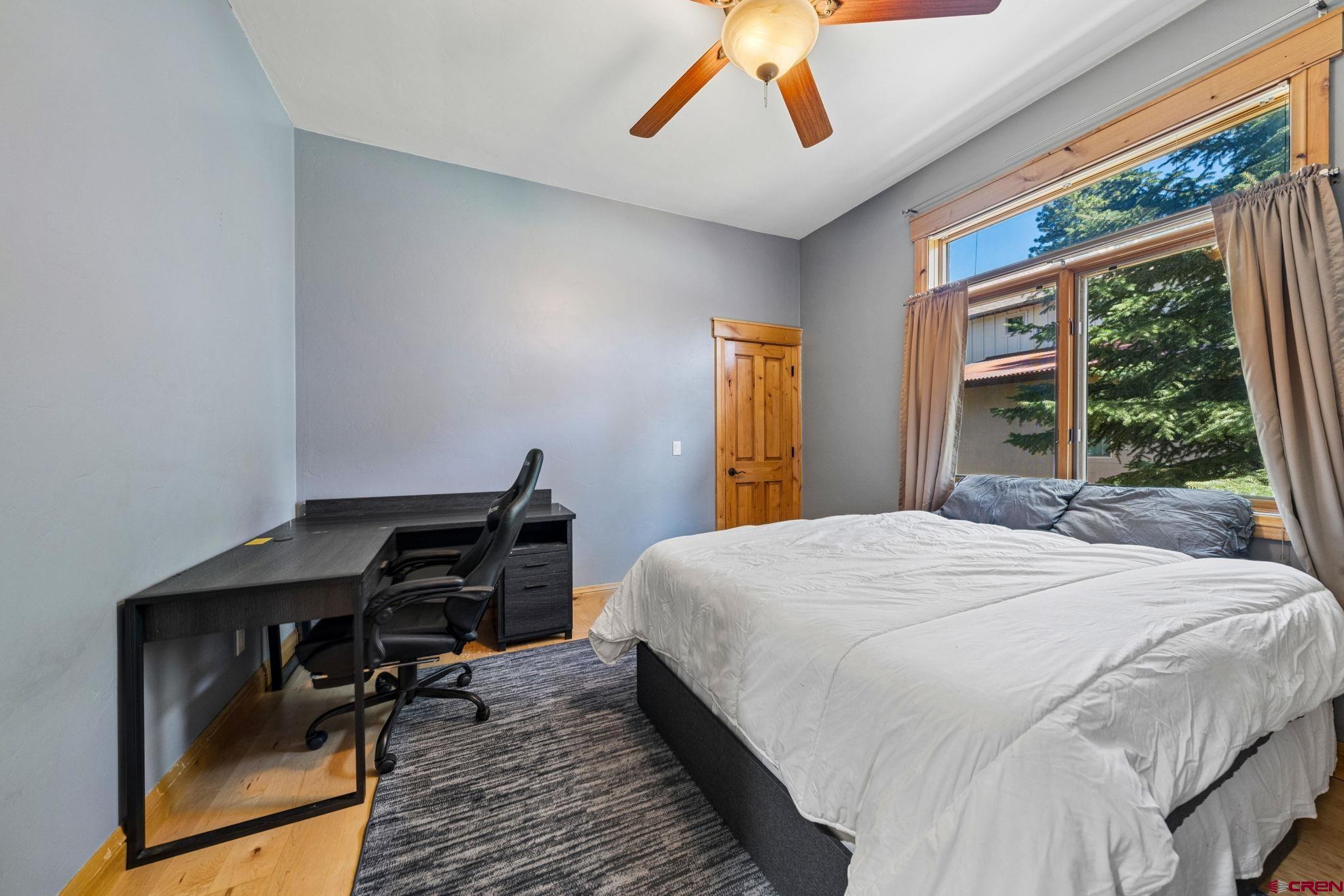 70 Clear Creek Loop Durango, CO 81301 - Photo 21 of 35 a bedroom with a bed and a window