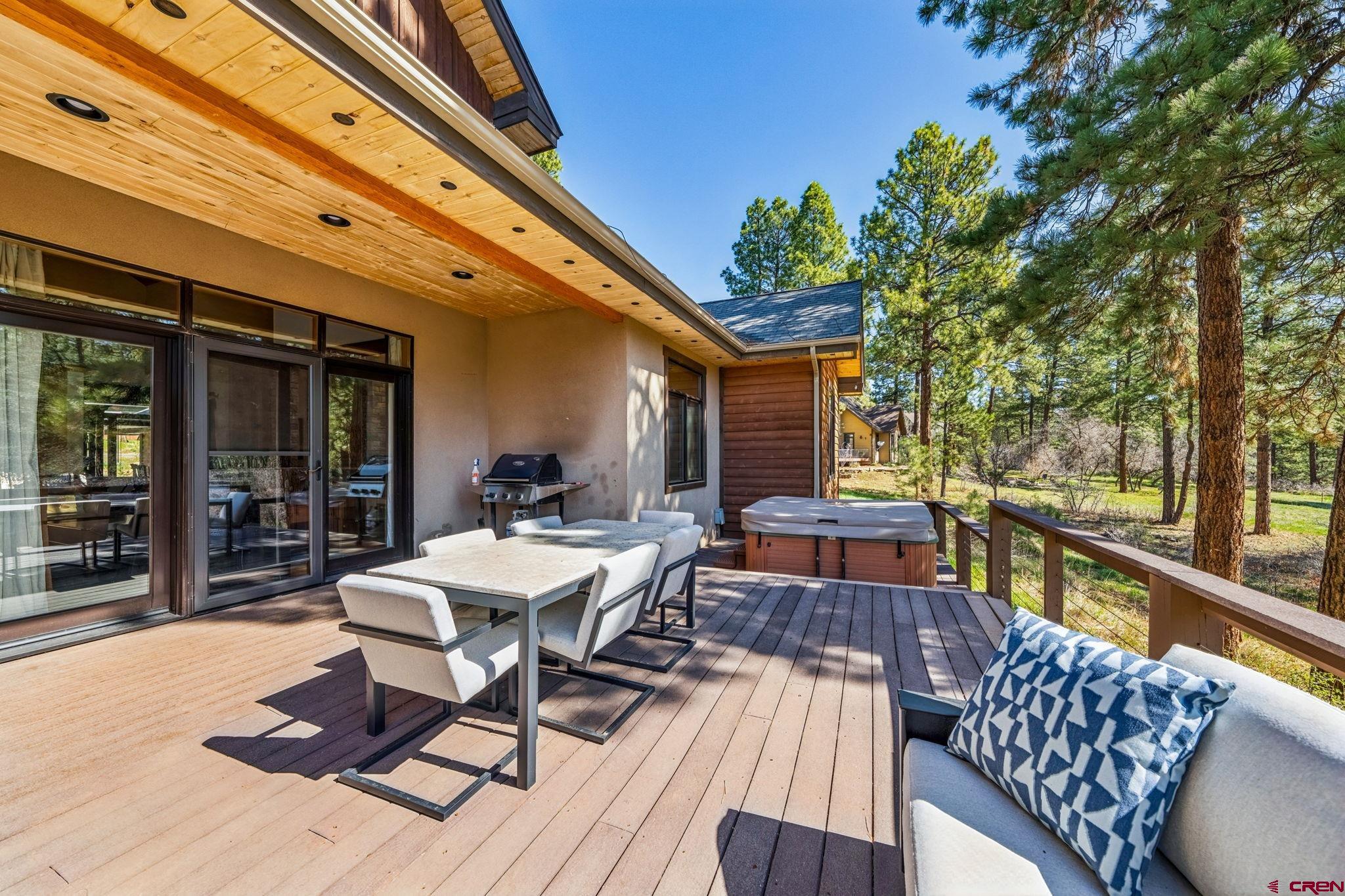 70 Clear Creek Loop Durango, CO 81301 - Photo 28 of 35 a view of a patio with table and chairs and wooden floor