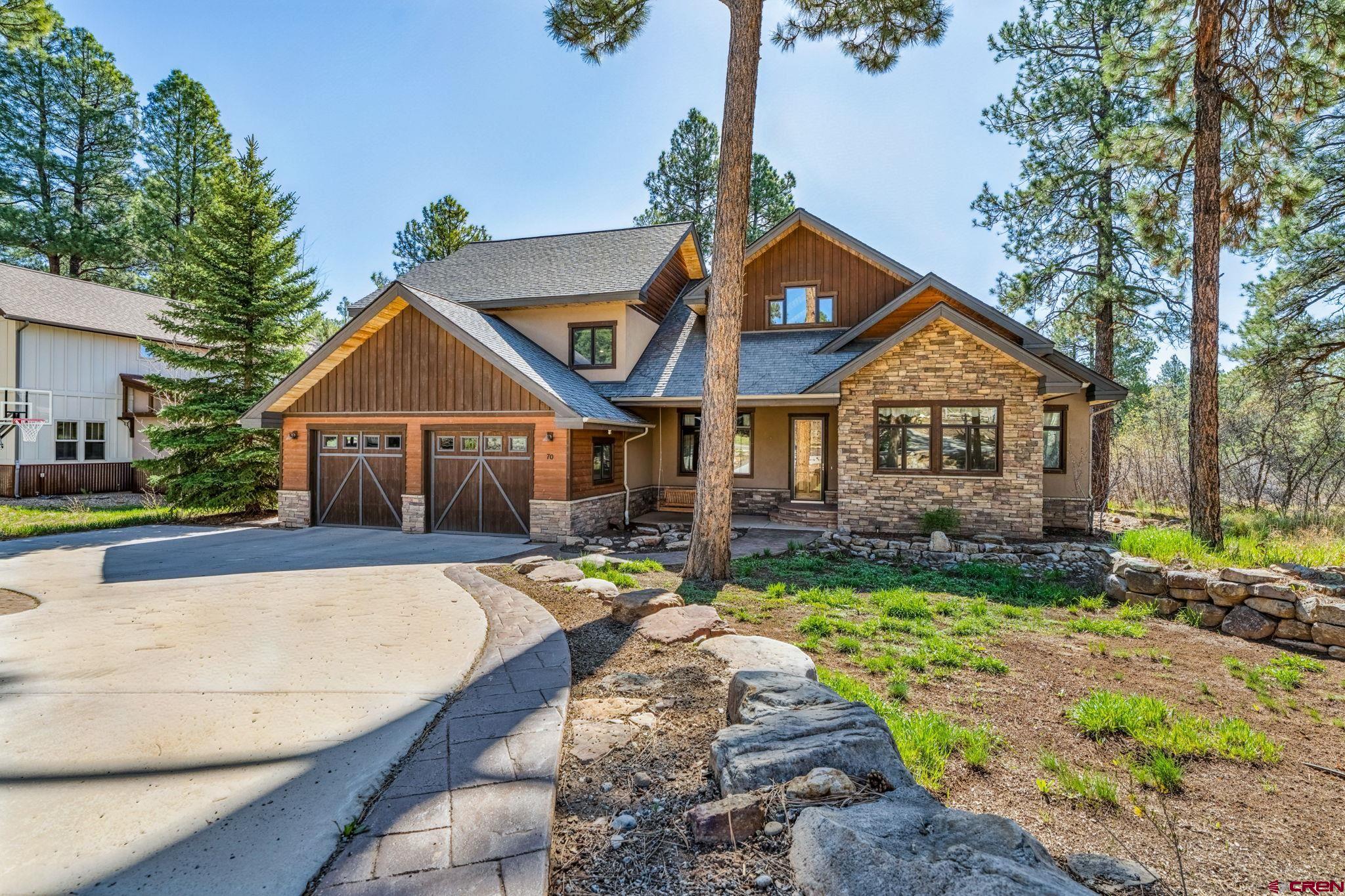 70 Clear Creek Loop Durango, CO 81301 - Photo 31 of 35 a front view of a house with a yard