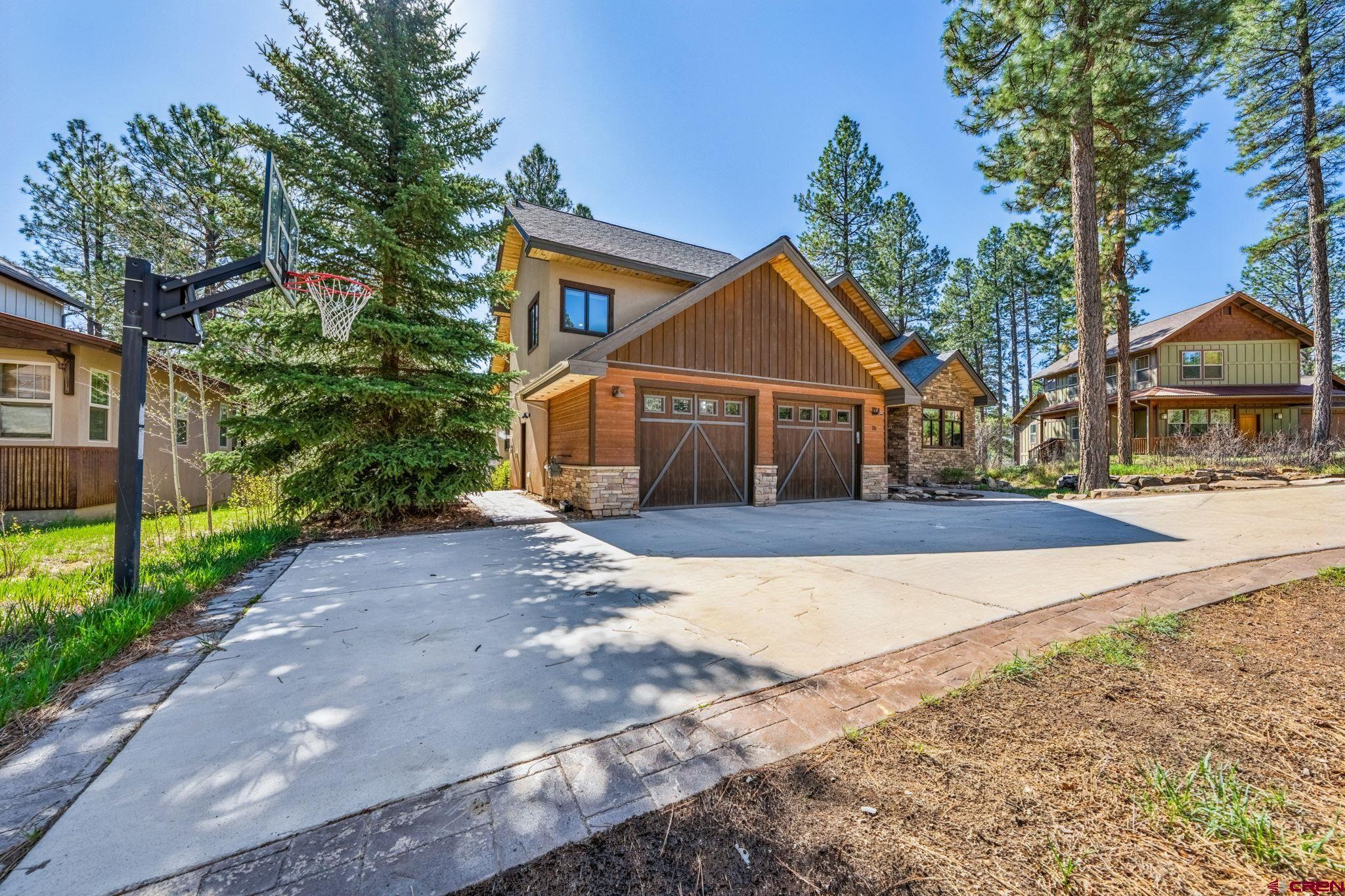 70 Clear Creek Loop Durango, CO 81301 - Photo 32 of 35 a front view of a house with a yard and garage