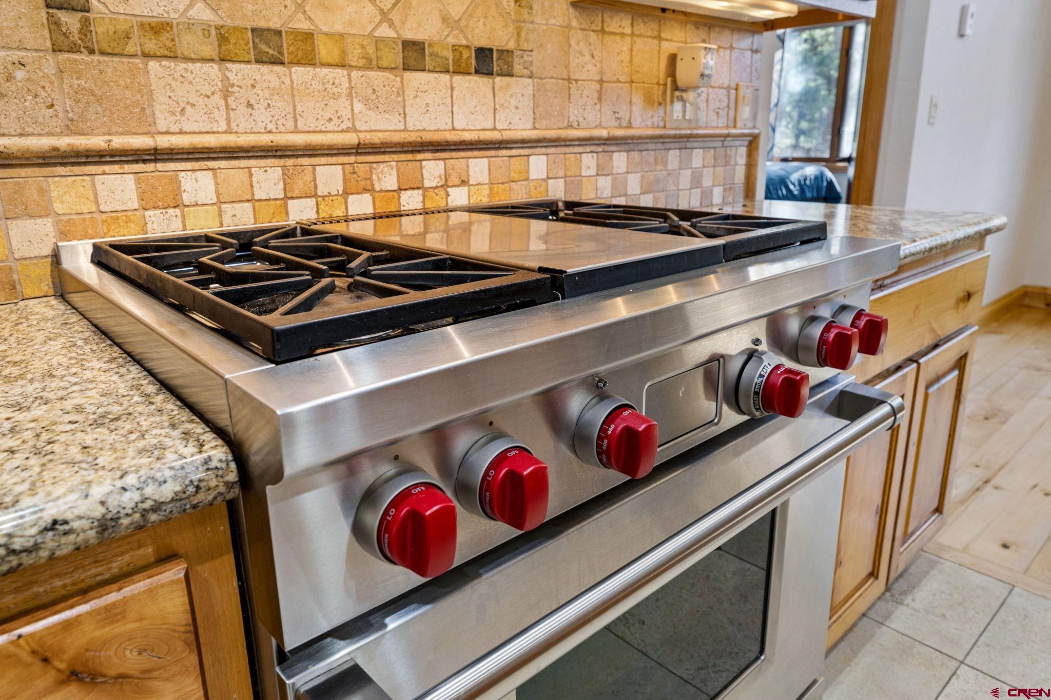 70 Clear Creek Loop Durango, CO 81301 - Photo 10 of 35 a stove top oven sitting inside of a kitchen