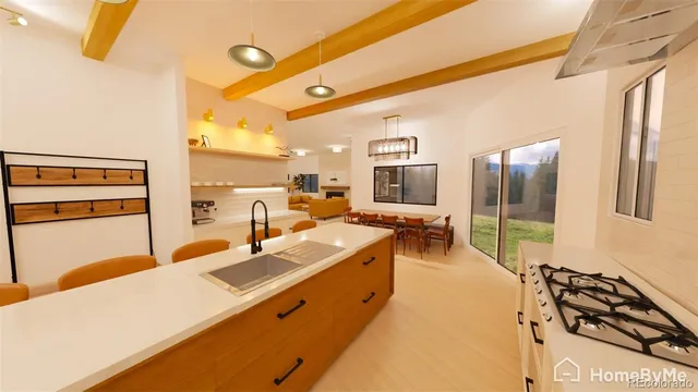 a very nice looking room with a large window and furniture