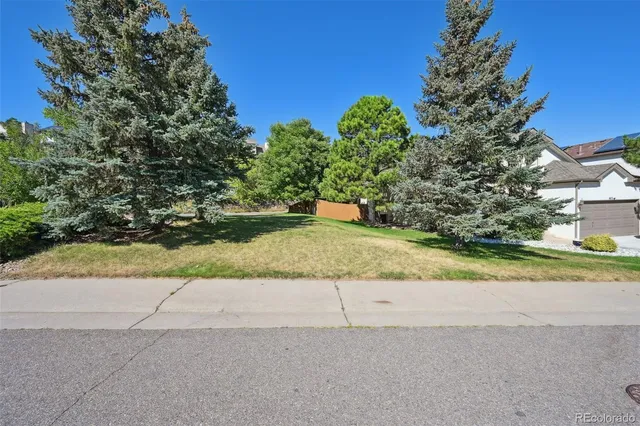 a view of a garden with a houses