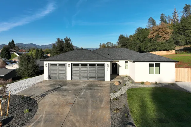 a view of house with yard