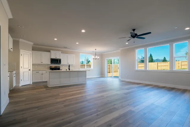 a view of kitchen with sink and wooden floor