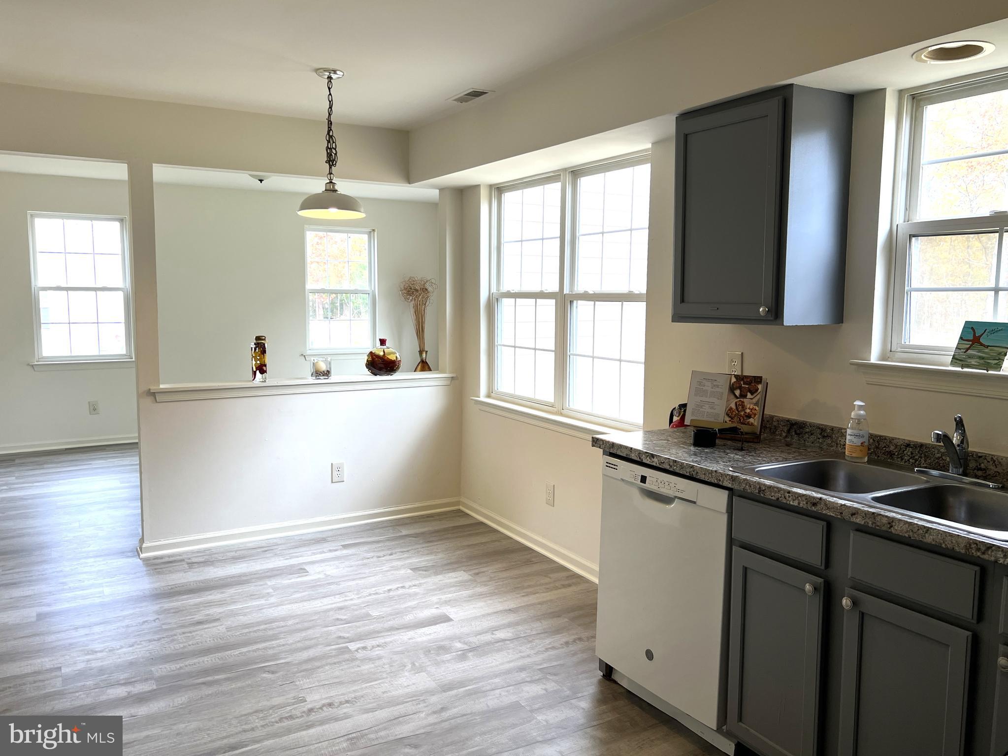 560 South Pitney Road Galloway Township, NJ 08205 - Photo 3 of 34 a kitchen with a sink a window and cabinets