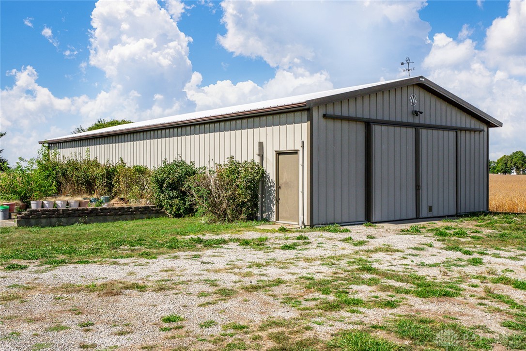 7404 Grubbs-Rex Road Arcanum, OH 45304 - Photo 28 of 40 This expansive outbuilding offers ample storage and versatile space for various needs, ideal for a workshop or equipment.