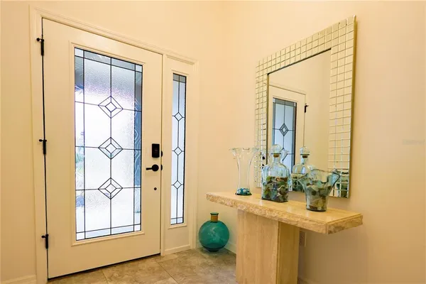 a bathroom with a sink a mirror and a shower