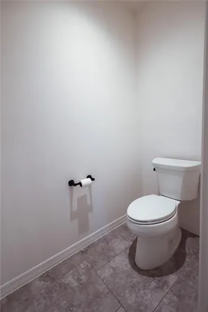 a bathroom with a toilet and a sink