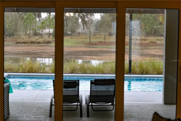 a view of a door and a window