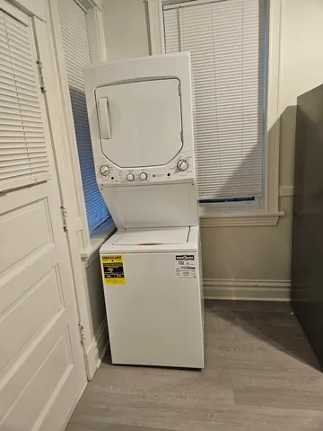 a kitchen with granite countertop a stove and a refrigerator