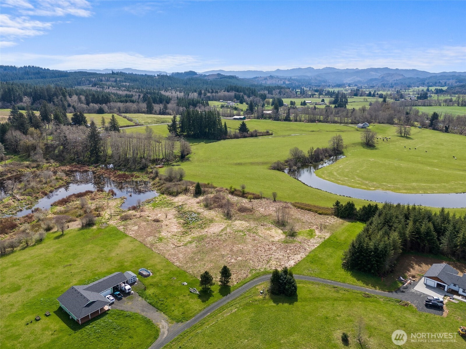 0 X Lilly Wheaton Road Raymond, WA 98577 - Photo 12 of 14 an aerial view of a house with a yard