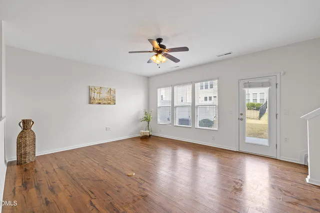 a kitchen with granite countertop a sink cabinets and window
