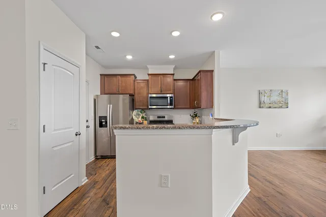 a ocean view of a building with a street