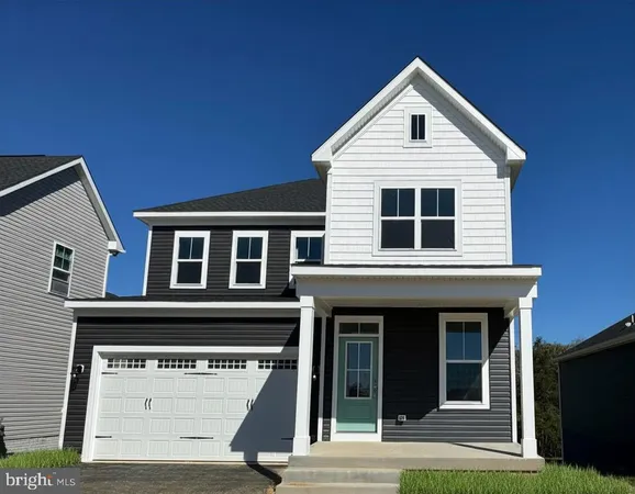 a view of a house with entrance and a yard