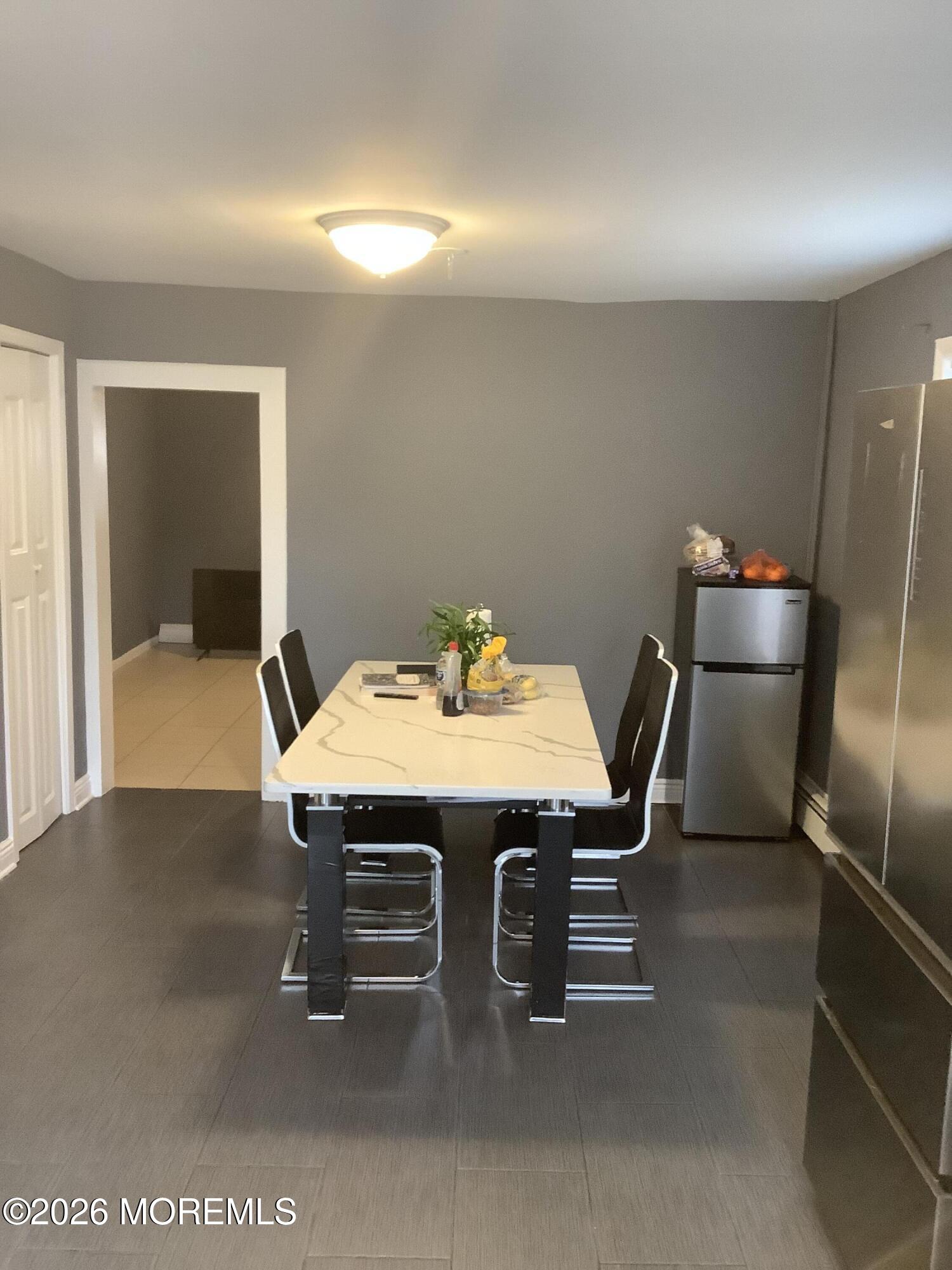 242 1st Street Keyport, NJ 07735 - Photo 19 of 23 a dining room with furniture and a chandelier