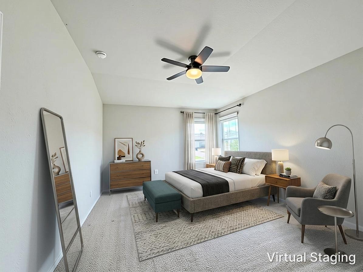 10502 Fulton Avenue Austin, TX 78754 - Photo 15 of 36 Well-lit sleeping quarters with a ceiling fan, inviting comfort and tranquility.