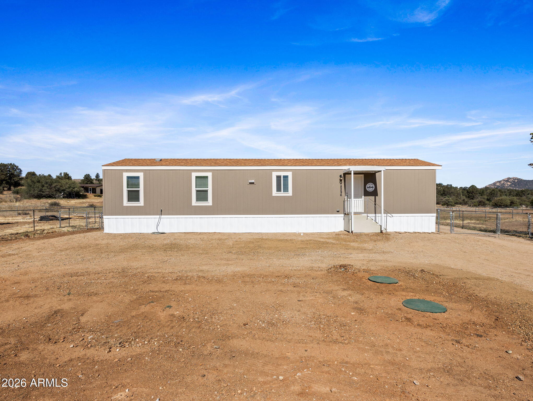 18296 Frontier Road Peeples Valley, AZ 86332 - Photo 41 of 44 a house view with a big yard