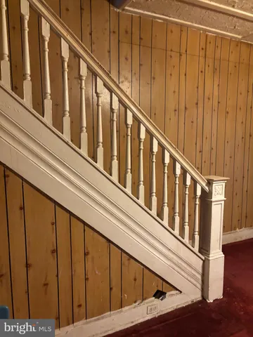 a view of staircase with wooden floor and stairs