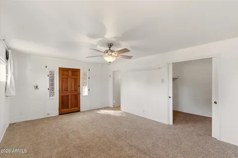 a view of an empty room with a window