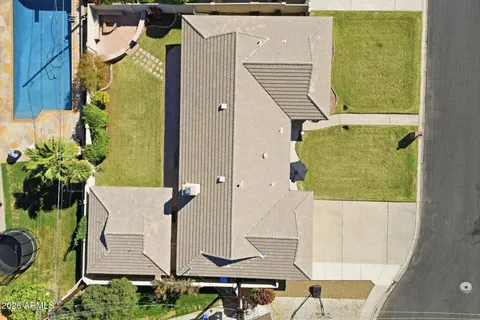 an aerial view of a house with a garden