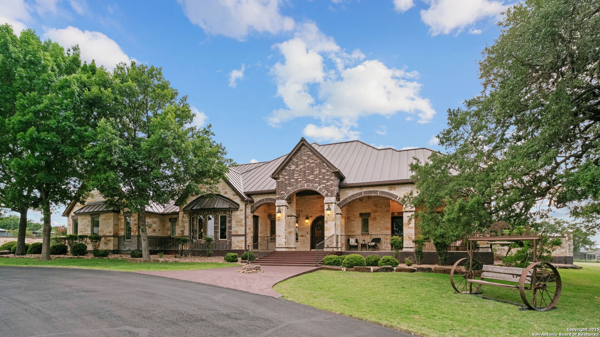208 Cascade Caverns Road Boerne, TX 78015 - Photo 19 of 74 a front view of a house with garden and trees