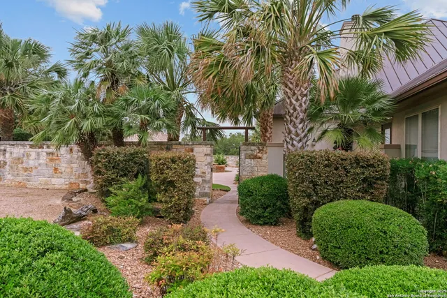 a view of a dining room with furniture and a chandelier