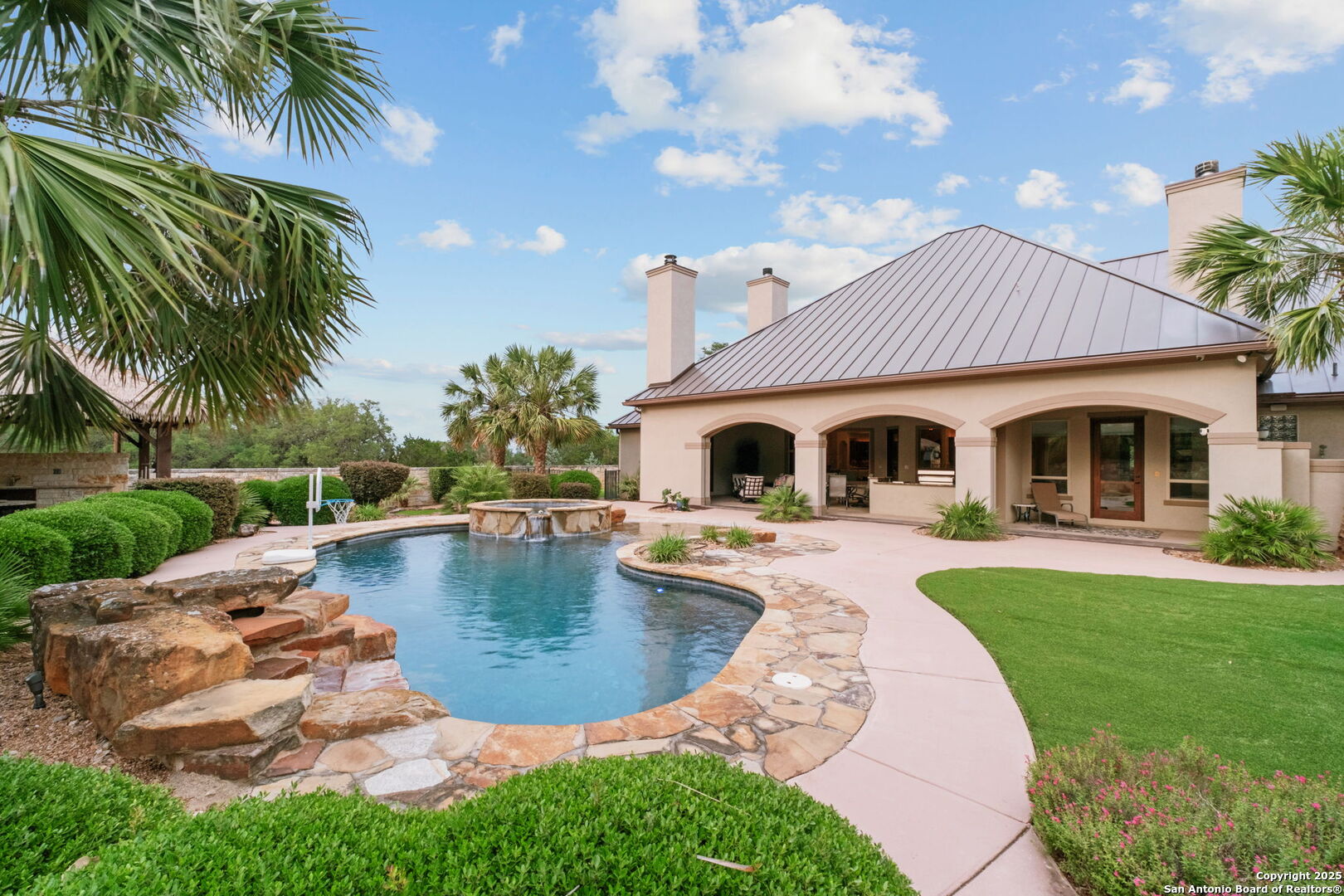 208 Cascade Caverns Road Boerne, TX 78015 - Photo 24 of 74 a swimming pool with outdoor seating and yard