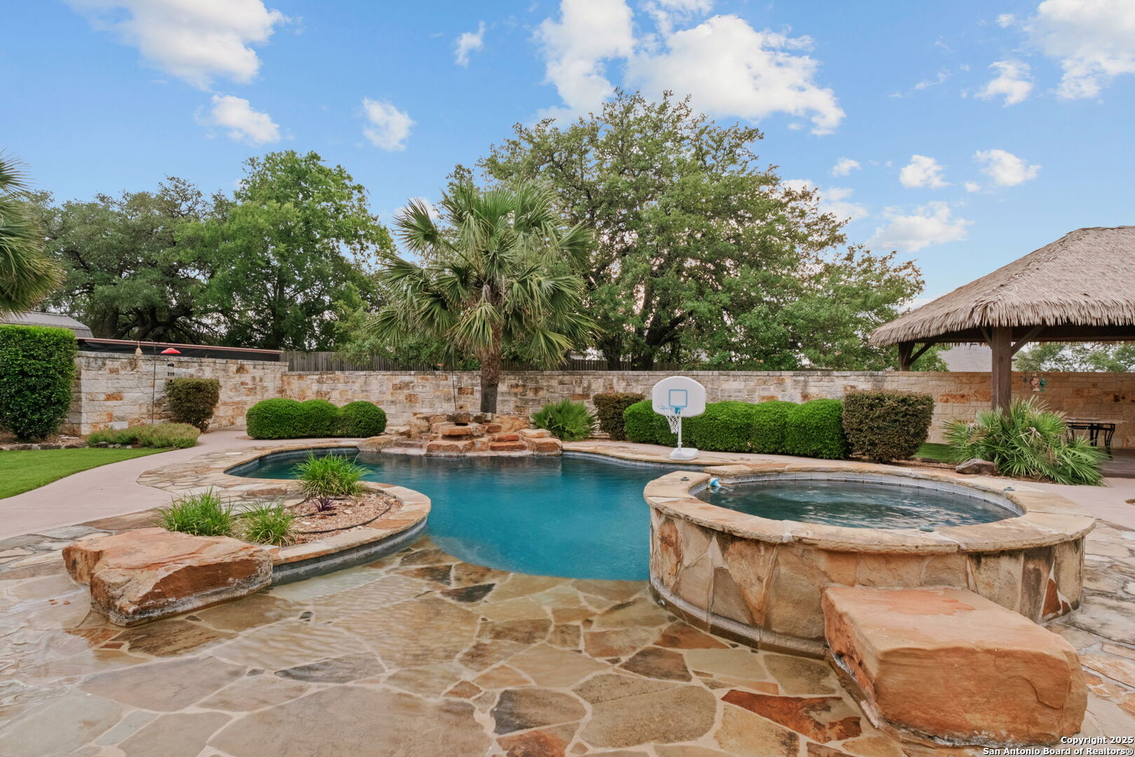 208 Cascade Caverns Road Boerne, TX 78015 - Photo 31 of 74 a view of a swimming pool with a patio