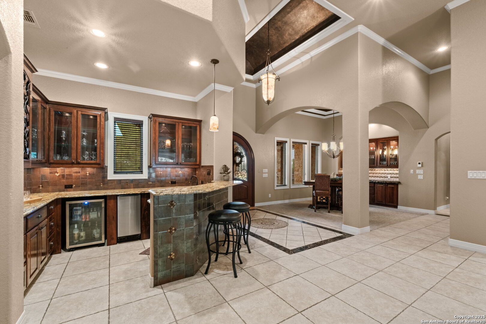 208 Cascade Caverns Road Boerne, TX 78015 - Photo 33 of 74 a kitchen with stainless steel appliances kitchen island granite countertop a sink and cabinets