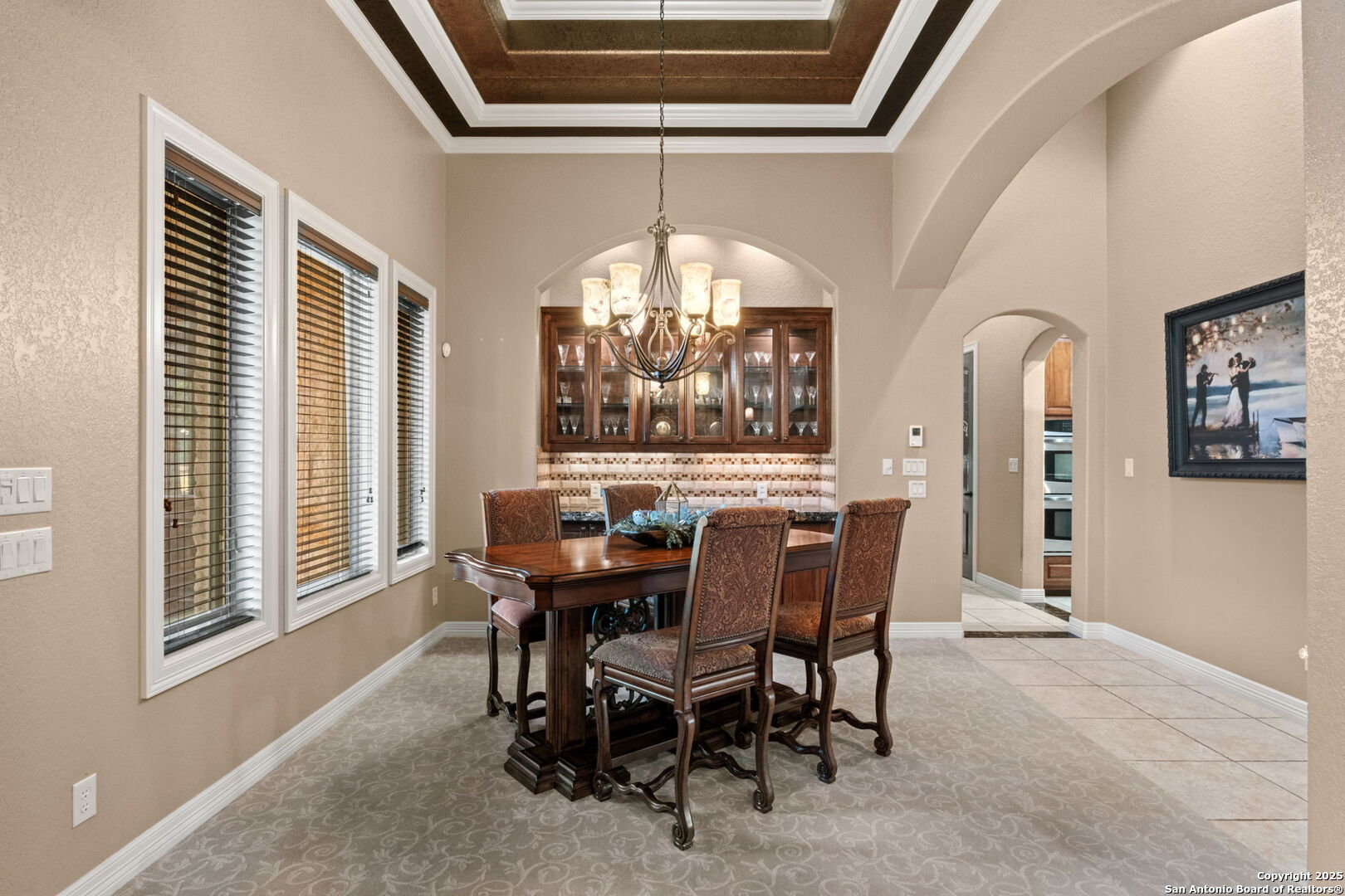 208 Cascade Caverns Road Boerne, TX 78015 - Photo 35 of 74 a view of a dining room with furniture and a chandelier
