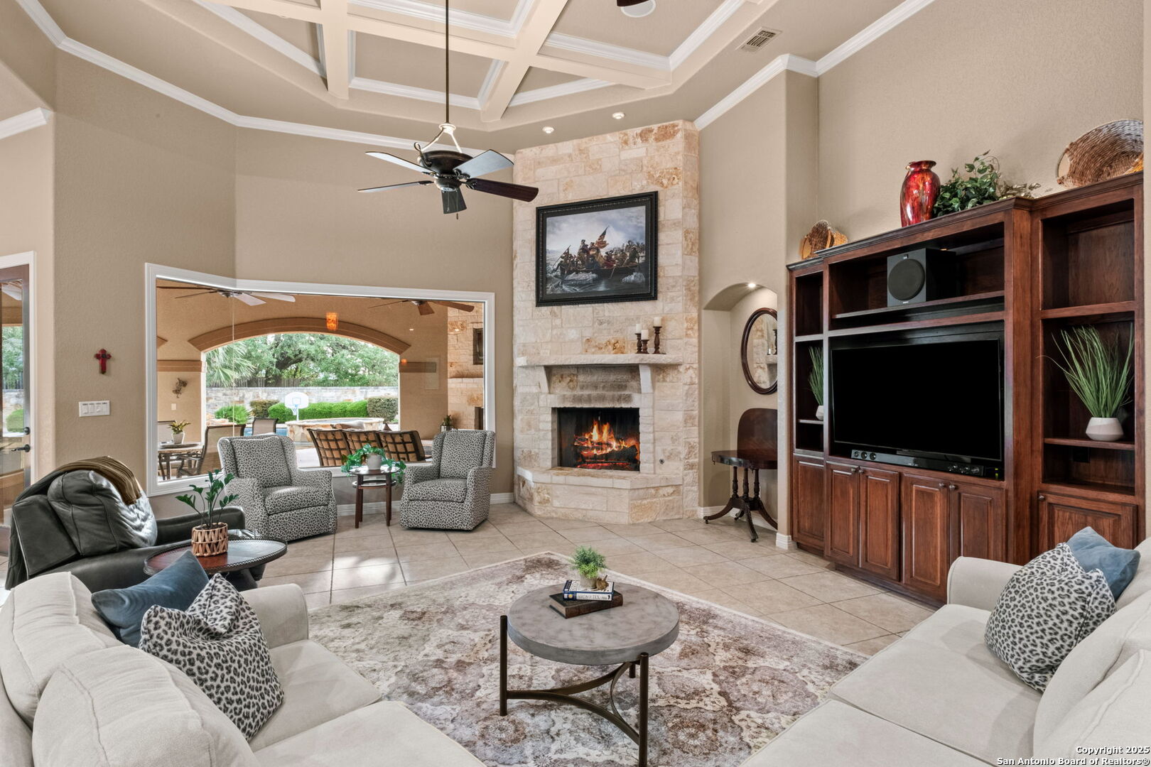 208 Cascade Caverns Road Boerne, TX 78015 - Photo 39 of 74 a living room with furniture a flat screen tv and a fireplace