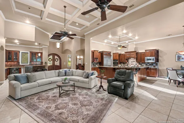 a bathroom with a granite countertop sink a mirror a vanity and shower