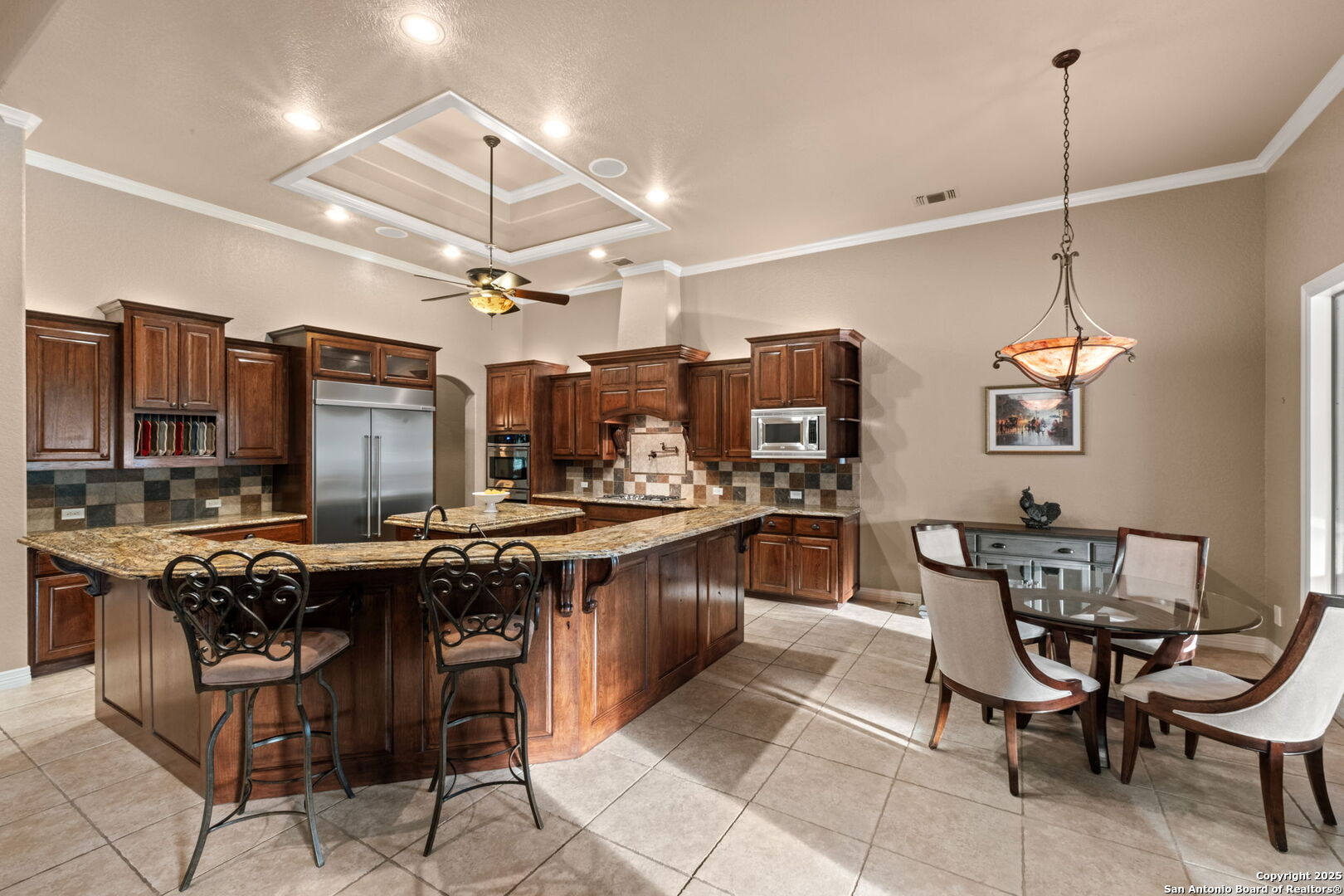 208 Cascade Caverns Road Boerne, TX 78015 - Photo 43 of 74 a kitchen that has a table and chairs in it