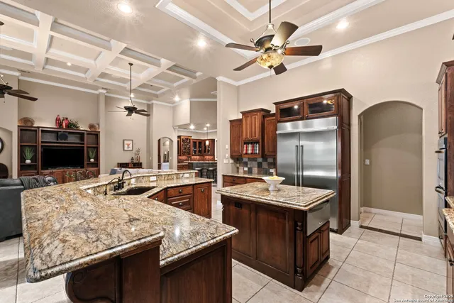 a view of a lake with a big yard and potted plants