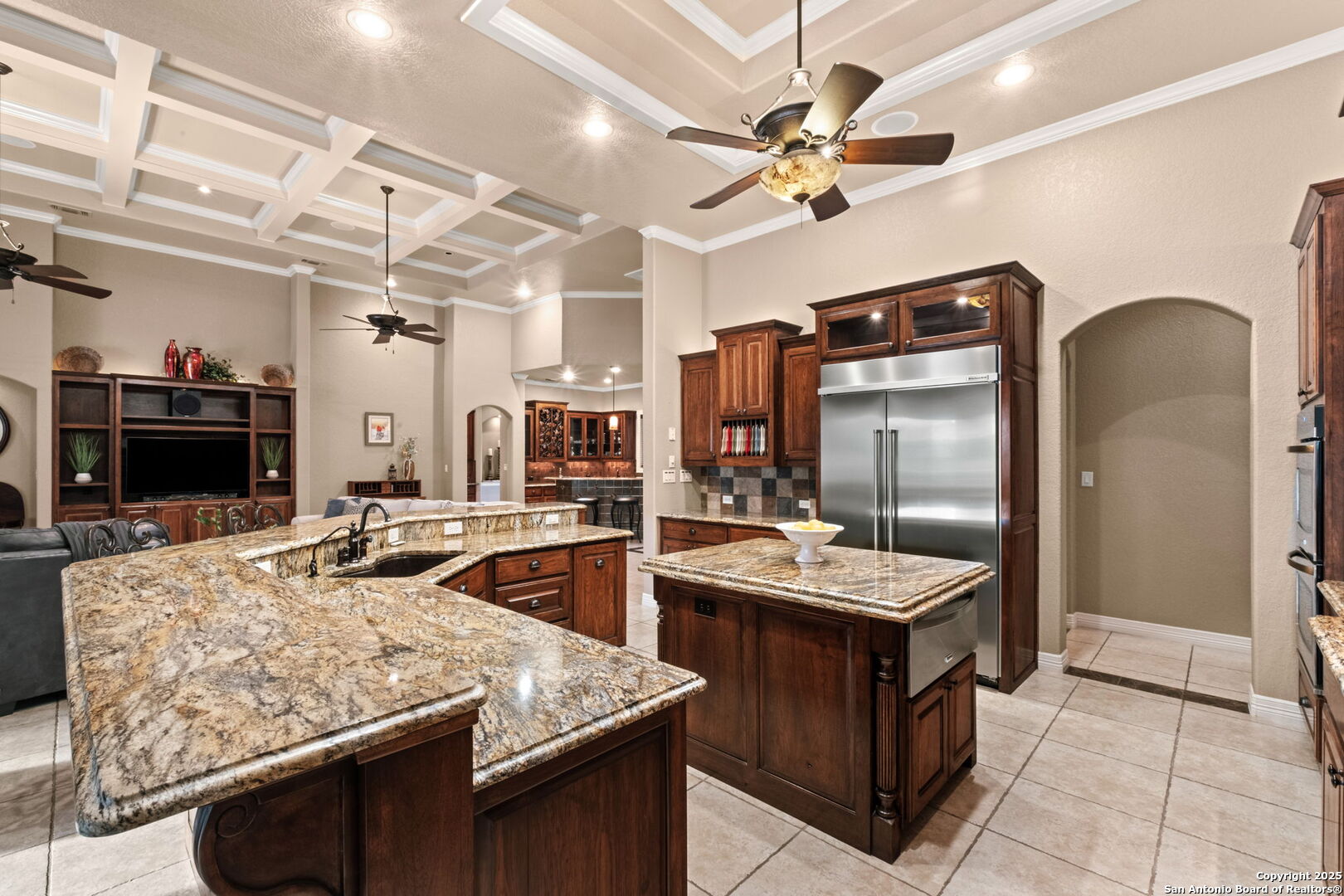 208 Cascade Caverns Road Boerne, TX 78015 - Photo 44 of 74 a kitchen with stainless steel appliances granite countertop a sink and a refrigerator