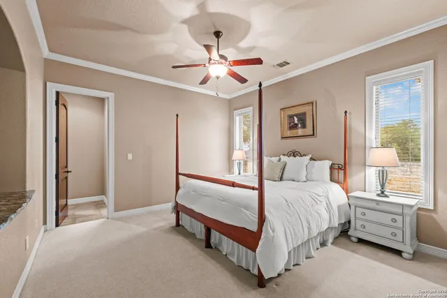 an aerial view of a house with swimming pool and garden