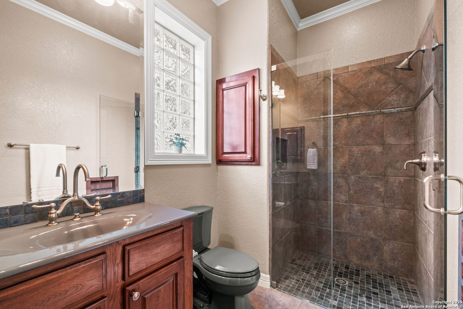 208 Cascade Caverns Road Boerne, TX 78015 - Photo 49 of 74 a bathroom with a granite countertop sink a toilet and shower