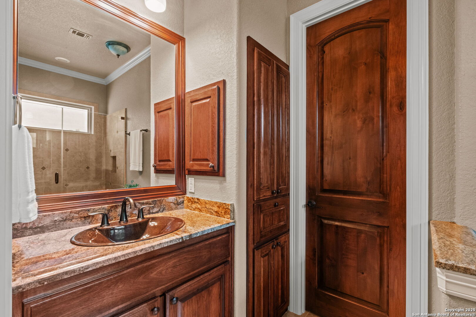 208 Cascade Caverns Road Boerne, TX 78015 - Photo 51 of 74 a bathroom with a sink and a mirror