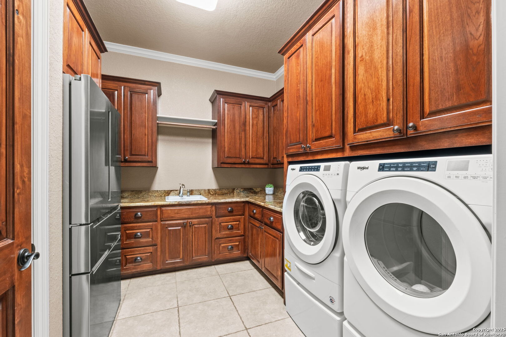 208 Cascade Caverns Road Boerne, TX 78015 - Photo 53 of 74 a kitchen with stainless steel appliances granite countertop a refrigerator and a sink