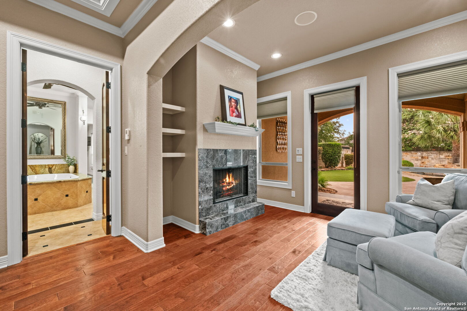 208 Cascade Caverns Road Boerne, TX 78015 - Photo 60 of 74 a living room with furniture and a fireplace